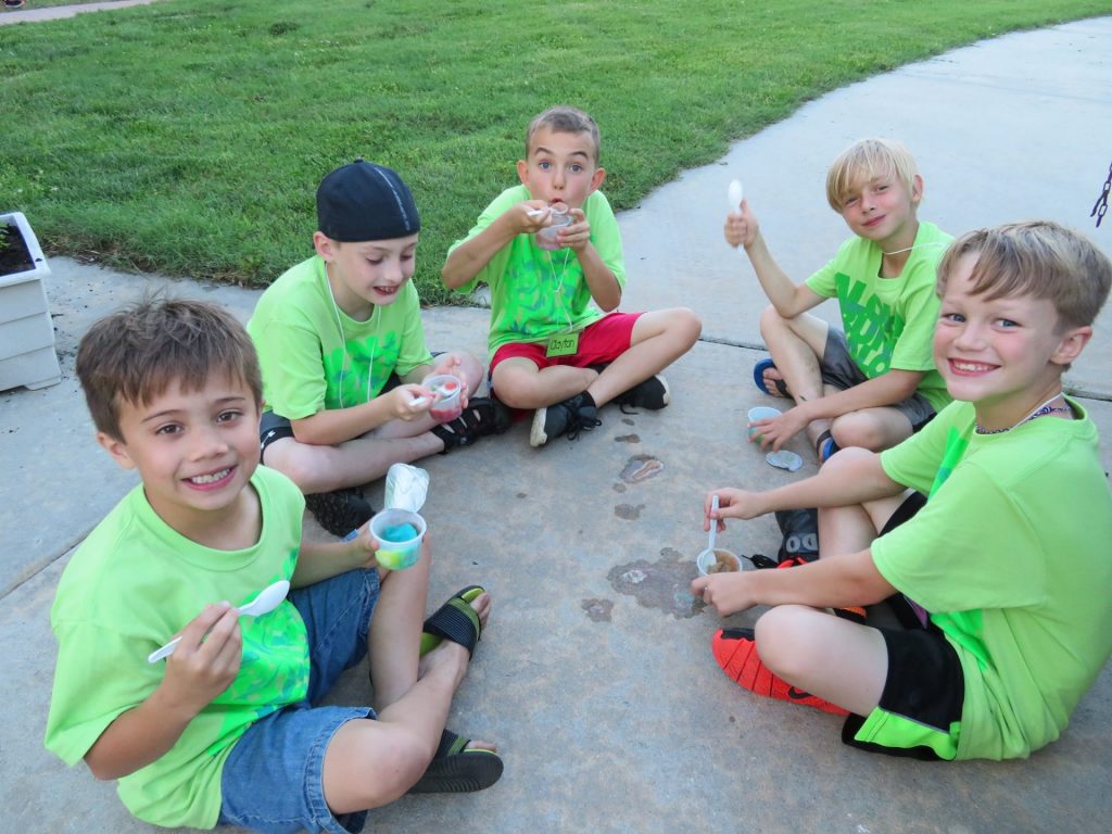 Boys eating ice cream at camp